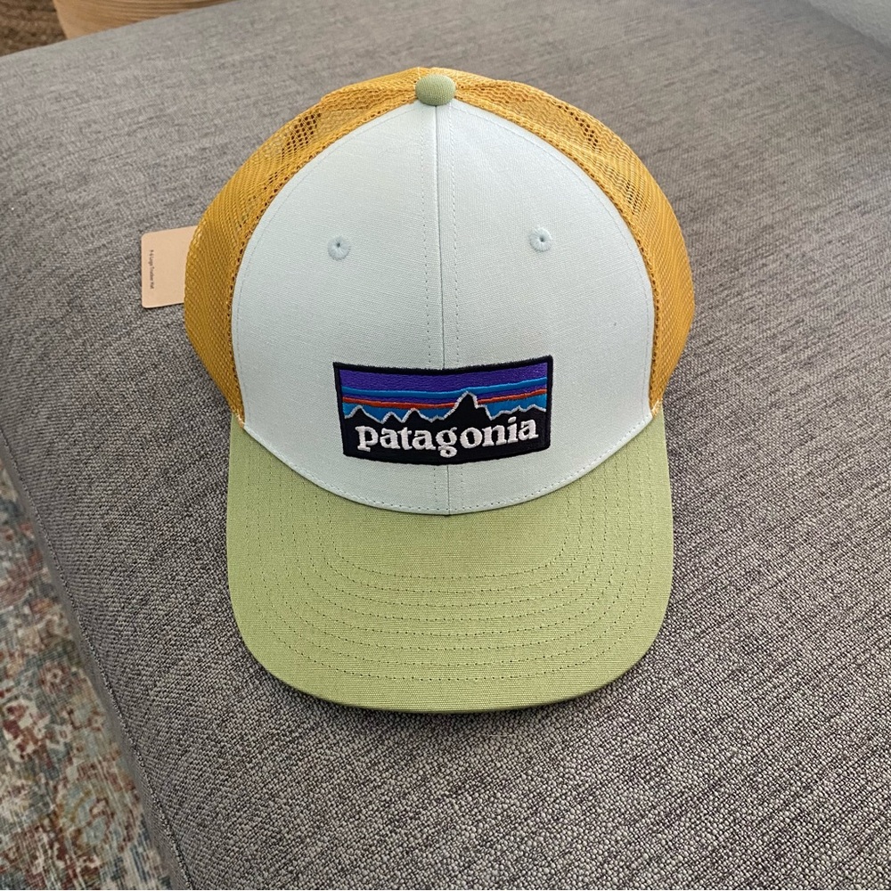 Patagonia Trucker Hat. Light blue, orange and green accents. NEW.